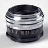 OBJEKTIV. Nikon. Nikkor El-Nikkor 1:5,6 f=80 mm Nippon Kogaku No. 828304. Cirka 1960.